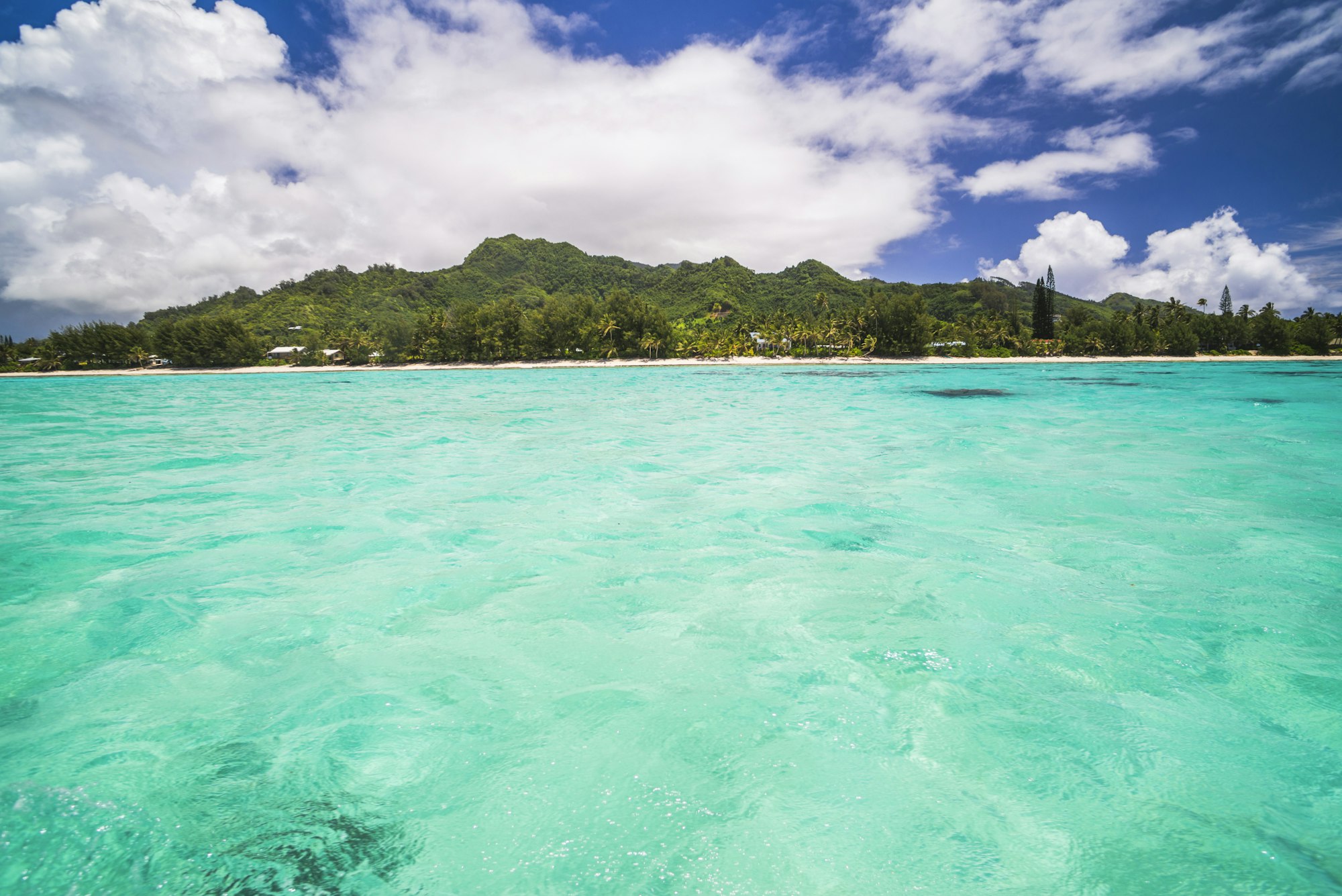 Tropical Island of Rarotonga seen from the beautiful crystal clear Pacific Ocean at Muri Lagoon, Rar